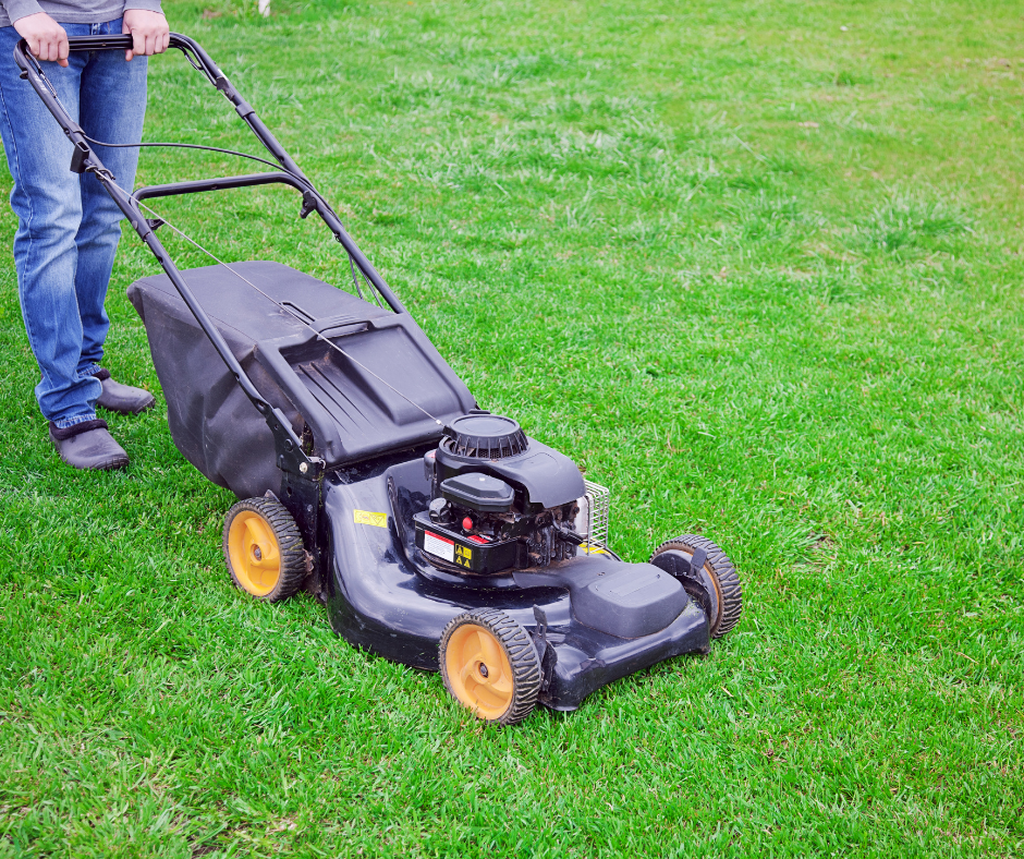 Person mowing lawn